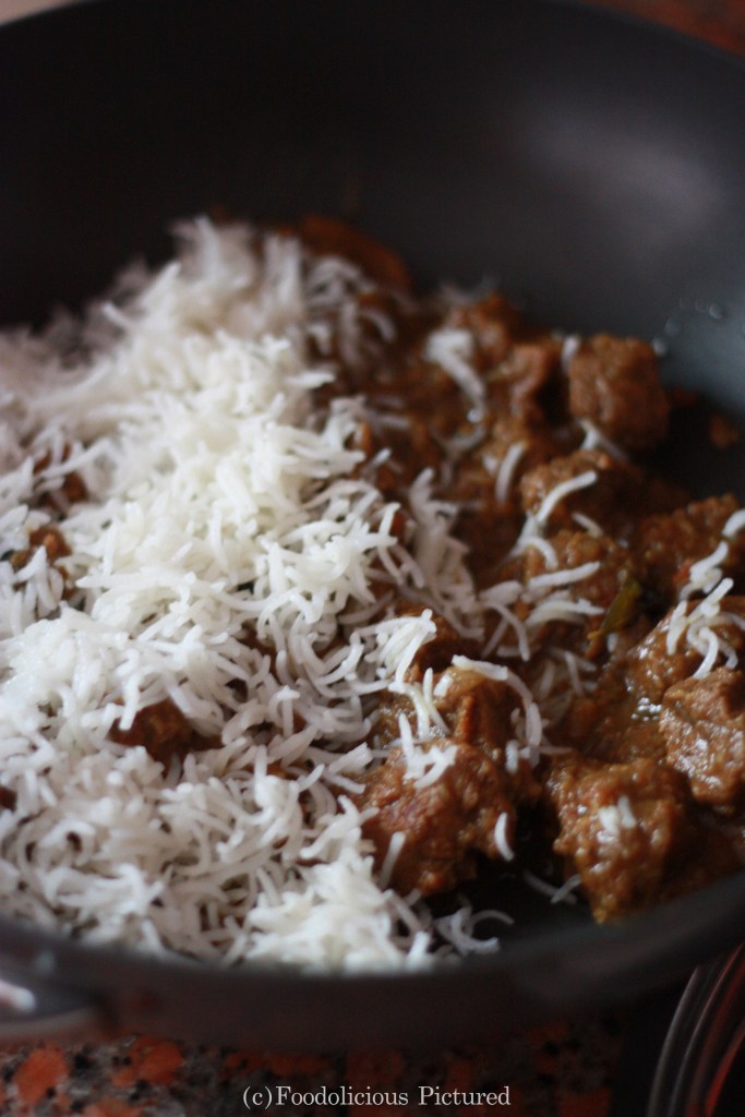 layering the rice and meat